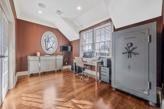 office space with lofted ceiling, plenty of natural light, visible vents, and wood finished floors