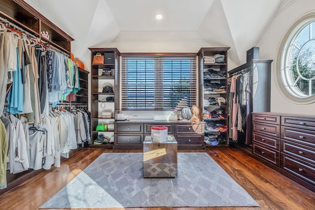 walk in closet featuring dark wood finished floors and vaulted ceiling