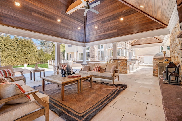 exterior space with exterior kitchen, an outdoor bar, ceiling fan, and an outdoor hangout area