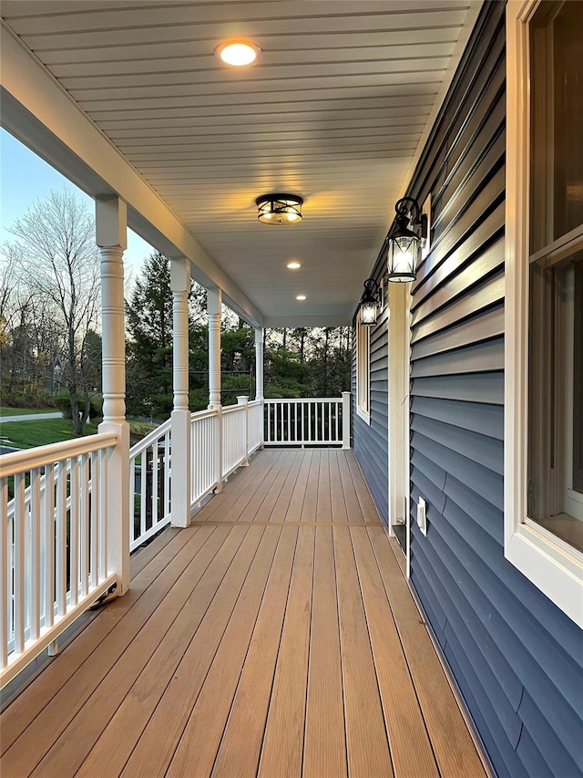 wooden terrace with a porch