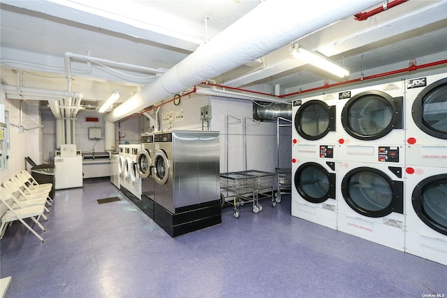 washroom with washing machine and clothes dryer and stacked washer and clothes dryer