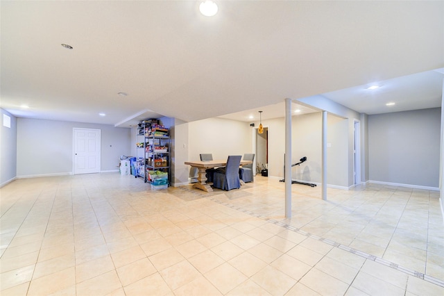 basement featuring light tile patterned floors