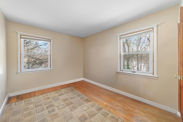 spare room featuring light hardwood / wood-style flooring