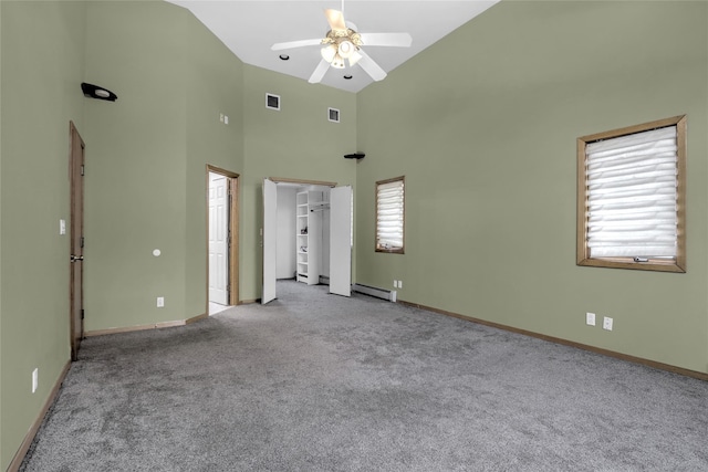 interior space with high vaulted ceiling, light colored carpet, ceiling fan, and baseboard heating