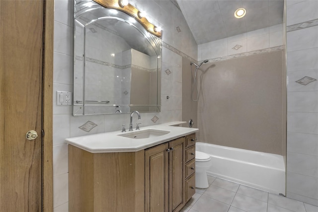 full bathroom with shower / tub combination, tile walls, tile patterned flooring, vanity, and toilet