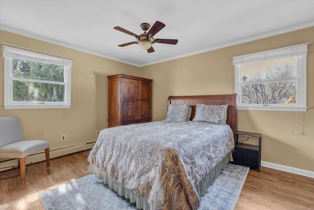 bedroom with baseboards, ceiling fan, crown molding, and light wood finished floors