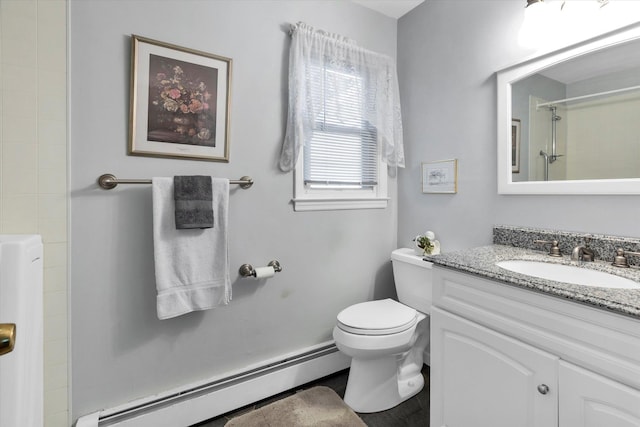 bathroom featuring baseboard heating, vanity, toilet, and a shower