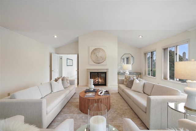 living room featuring light colored carpet, recessed lighting, a glass covered fireplace, and vaulted ceiling