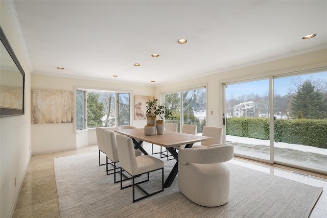 dining space with recessed lighting, plenty of natural light, and ornamental molding