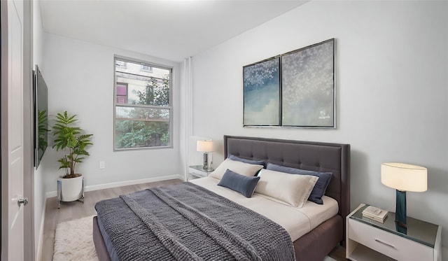 bedroom with light hardwood / wood-style flooring