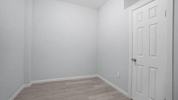 empty room with light hardwood / wood-style floors