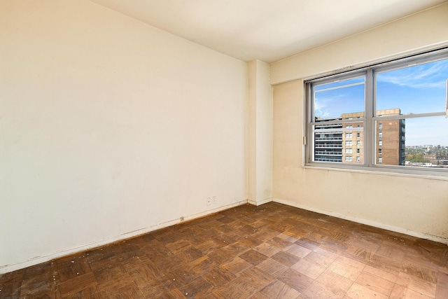 70-25 Yellowstone Blvd Unit 18A, Forest Hills, NY 11375 - empty room featuring baseboards and a city view