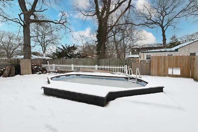 view of snow covered pool