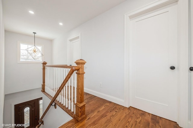 2101 Fir St, Wantagh, NY 11793 - hallway featuring an upstairs landing, wood finished floors, and recessed lighting