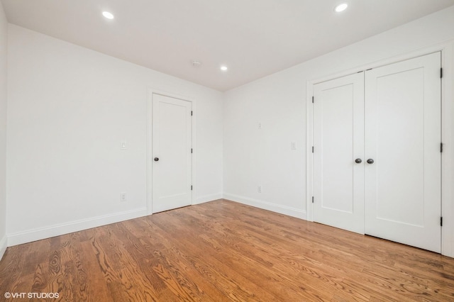 2101 Fir St, Wantagh, NY 11793 - unfurnished bedroom featuring light wood finished floors and recessed lighting