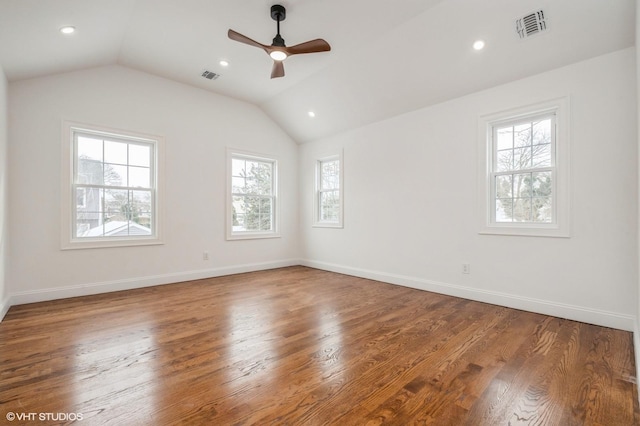 2101 Fir St, Wantagh, NY 11793 - spare room with plenty of natural light, a ceiling fan, vaulted ceiling, wood finished floors, and recessed lighting