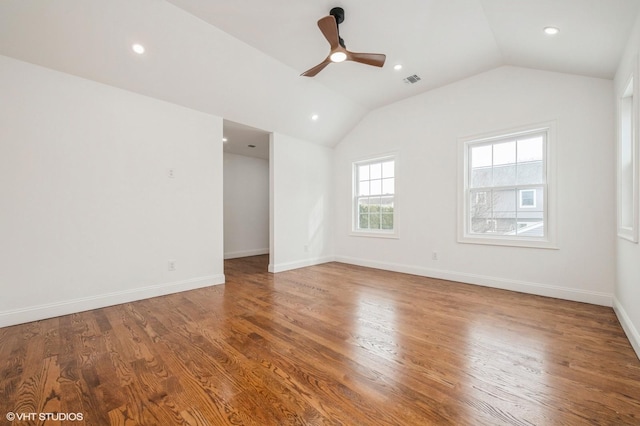 2101 Fir St, Wantagh, NY 11793 - empty room featuring vaulted ceiling, a ceiling fan, wood finished floors, and recessed lighting