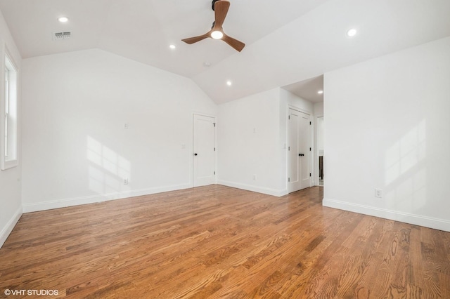 2101 Fir St, Wantagh, NY 11793 - unfurnished room with a ceiling fan, recessed lighting, vaulted ceiling, and light wood-style flooring