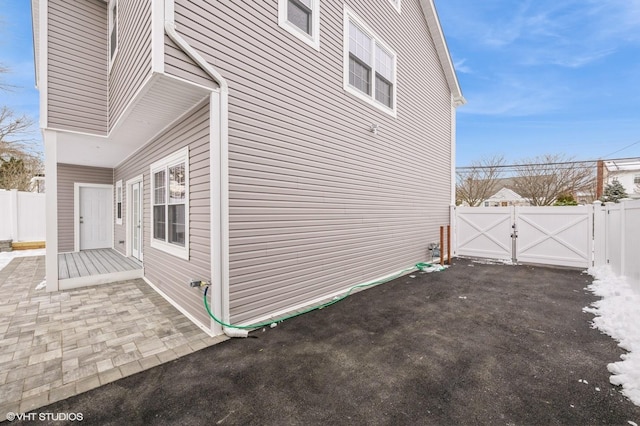 2101 Fir St, Wantagh, NY 11793 - view of home's exterior with a gate and a patio area