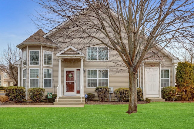 traditional-style house with a front yard