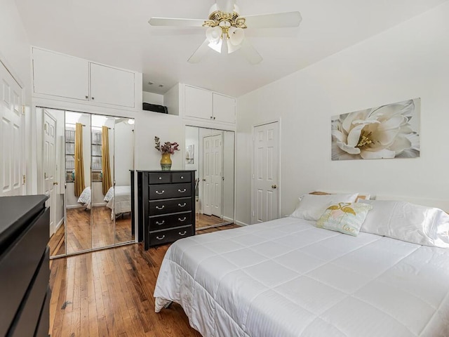91 E 208th St Unit 3K, Bronx, NY 10467 - bedroom with two closets, dark wood finished floors, and ceiling fan