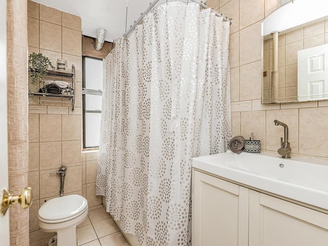 91 E 208th St Unit 3K, Bronx, NY 10467 - bathroom featuring tile walls, tile patterned flooring, vanity, and toilet