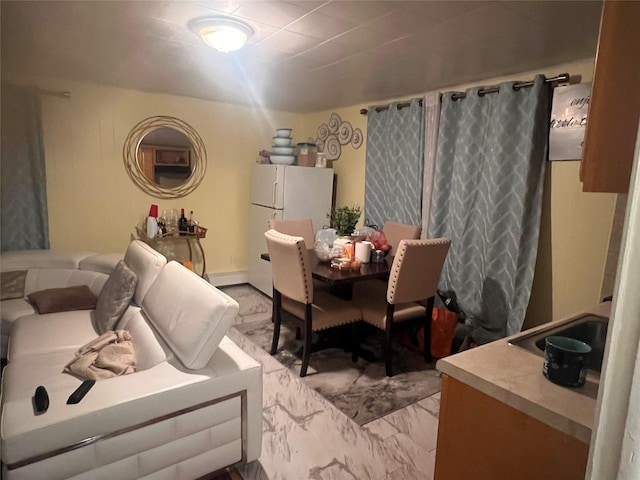 dining space with marble finish floor