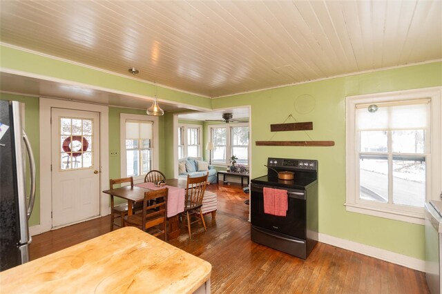 807 Lucas Avenue Ext, Hurley, NY 12443 - kitchen with electric range oven, freestanding refrigerator, dark wood-style floors, crown molding, and baseboards