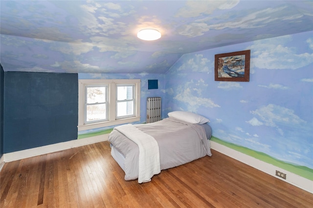807 Lucas Avenue Ext, Hurley, NY 12443 - bedroom featuring lofted ceiling, hardwood / wood-style floors, and baseboards
