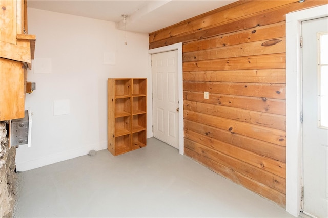 807 Lucas Avenue Ext, Hurley, NY 12443 - empty room with finished concrete floors and wooden walls