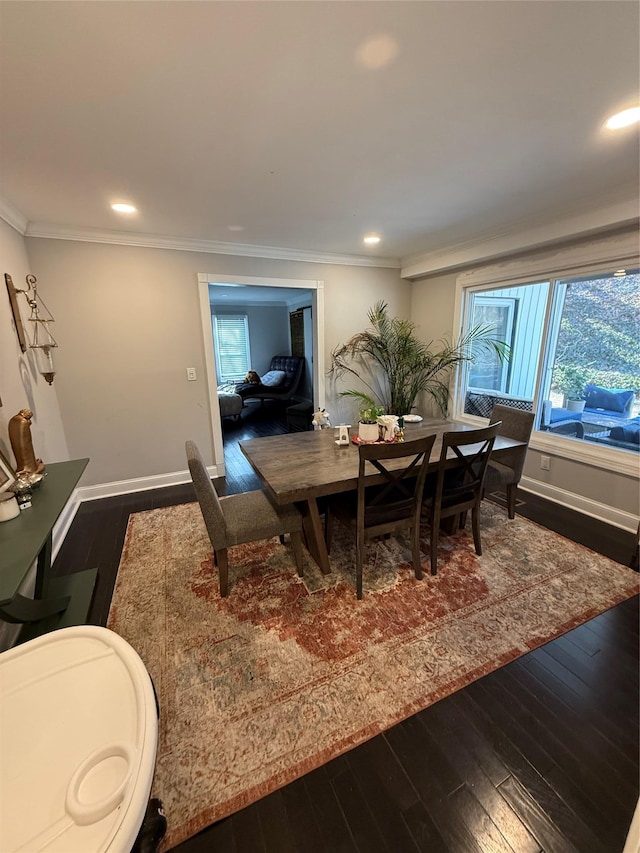 dining space with ornamental molding, dark wood-type flooring, recessed lighting, and baseboards