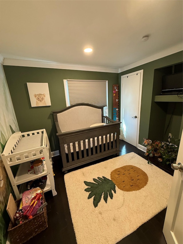 bedroom with crown molding, dark wood-style flooring, and recessed lighting