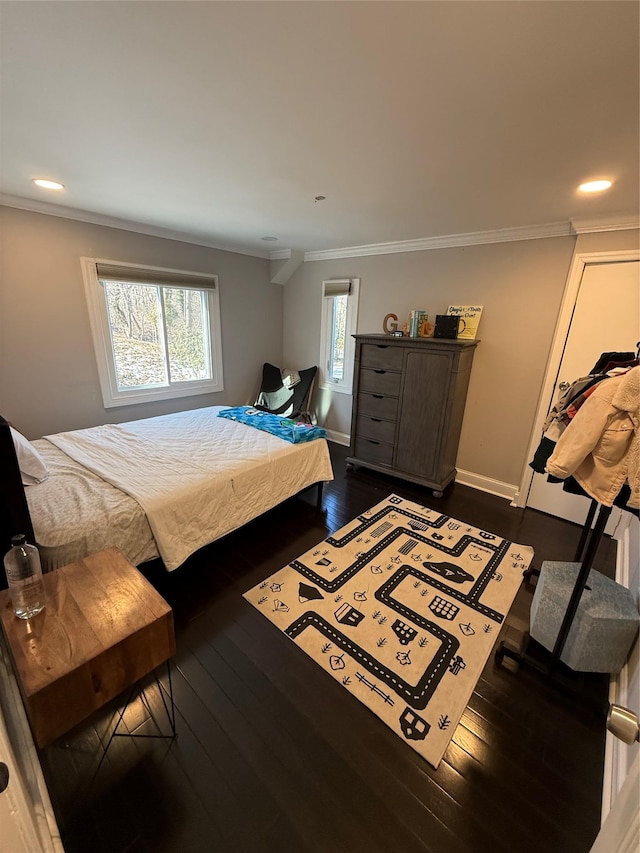 bedroom with crown molding, baseboards, dark wood-type flooring, and recessed lighting