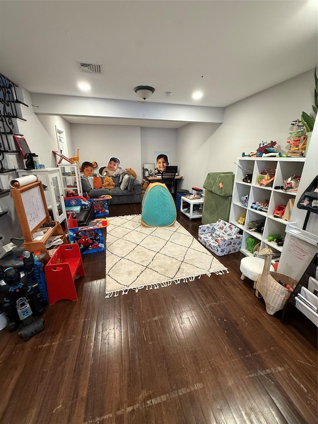 recreation room with visible vents and hardwood / wood-style floors