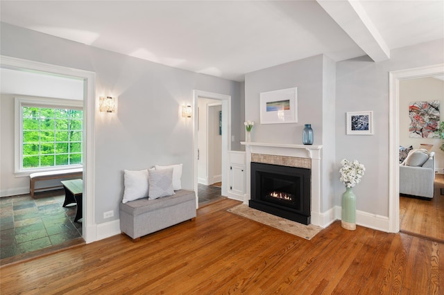 58 Spring Ln, Chappaqua, NY 10514 - living room with a tiled fireplace, wood finished floors, and baseboards