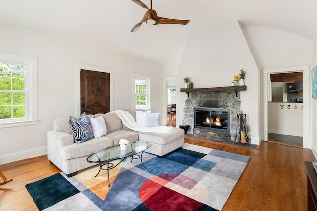 58 Spring Ln, Chappaqua, NY 10514 - living room featuring wood finished floors, ceiling fan, a fireplace, baseboards, and lofted ceiling