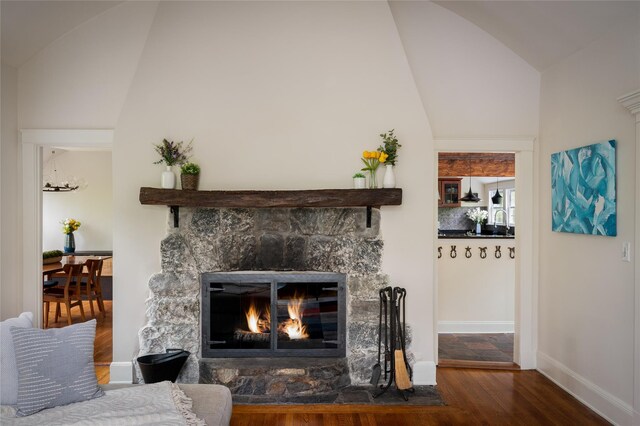 58 Spring Ln, Chappaqua, NY 10514 - living area featuring vaulted ceiling, a fireplace, wood finished floors, and baseboards