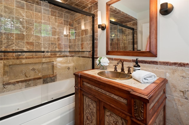 58 Spring Ln, Chappaqua, NY 10514 - bathroom featuring tile walls, a combined bath / shower with jetted tub, and vanity