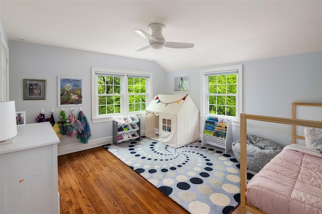 58 Spring Ln, Chappaqua, NY 10514 - bedroom with vaulted ceiling, multiple windows, wood finished floors, baseboards, and a ceiling fan