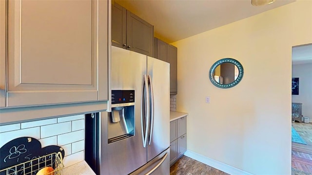 kitchen featuring dark hardwood / wood-style floors and stainless steel fridge