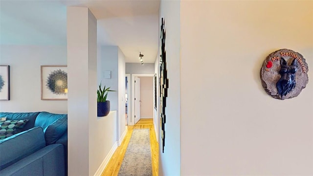 corridor featuring light hardwood / wood-style flooring