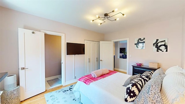 bedroom with light hardwood / wood-style floors