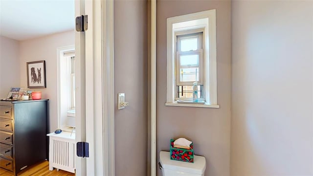 hallway featuring radiator heating unit