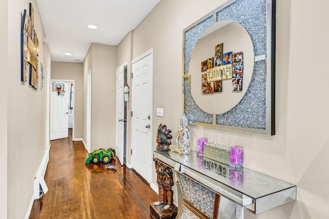 hall with dark hardwood / wood-style floors