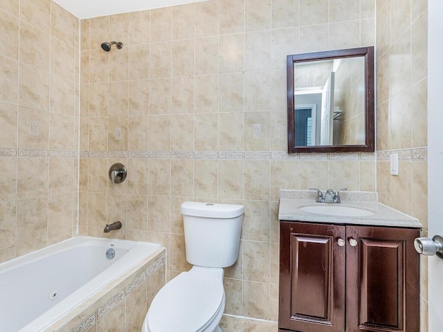 full bathroom with tiled shower / bath, vanity, toilet, and tile walls