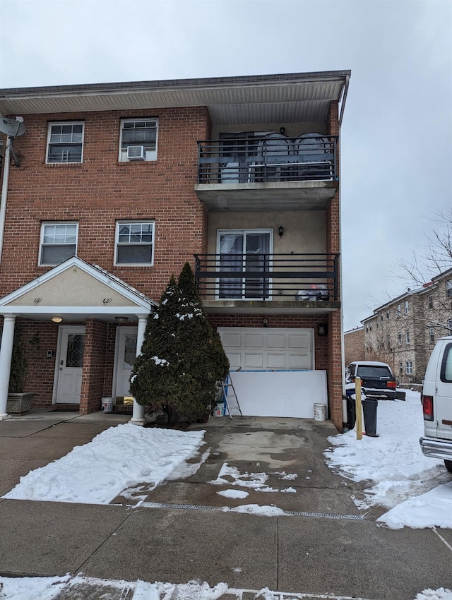 view of front of house with a balcony and a garage