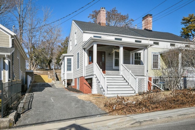 bungalow-style house with a porch and ceiling fan