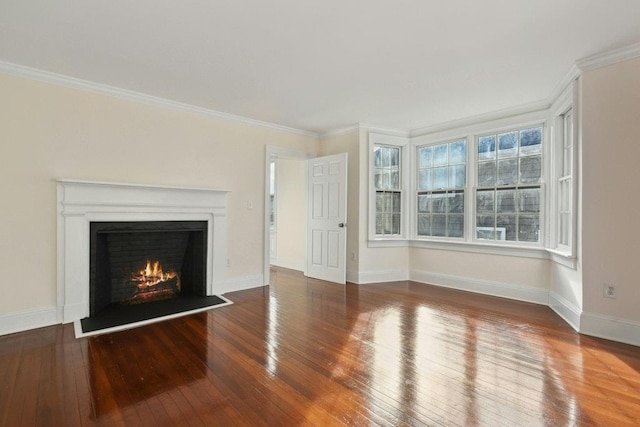 unfurnished living room with hardwood / wood-style floors and ornamental molding