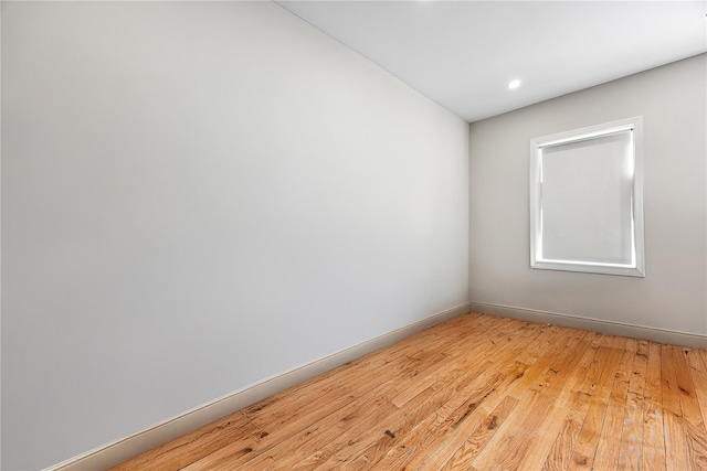 spare room with light wood-type flooring