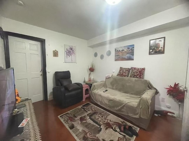 living room with dark hardwood / wood-style flooring